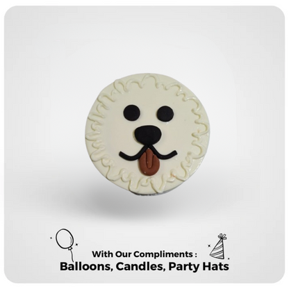 A themed cake decorated to look like a poodle with a white base and brown detailing, accompanied by text that reads 'With our compliments: Balloons, Candles, Party Hats'.