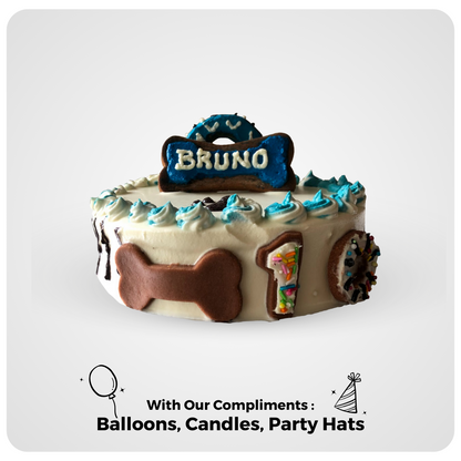 A decorative dog cake with 'BRUNO' written on top, bone-shaped biscuits, and various toppings.